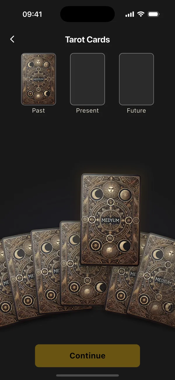 Tarot screen: a deck fanned out, one card placed in the Past position and another lifted from the fan